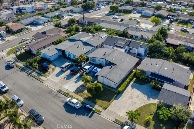 an aerial view of a house with a yard basket ball court and outdoor seating