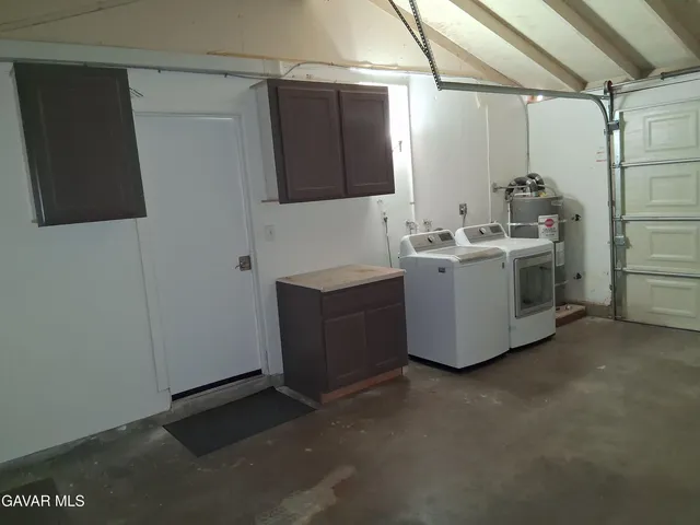 a room with cabinets and dust bin