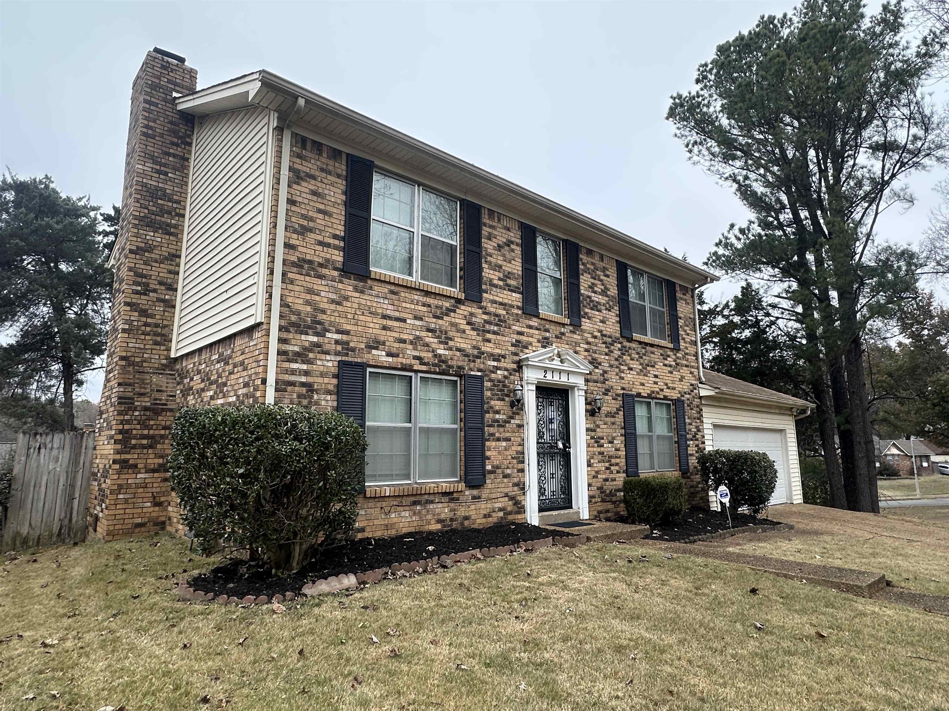 2111 Rock Ridge Road Memphis, TN 38134 - Photo 2 of 20 a front view of a house with a garden