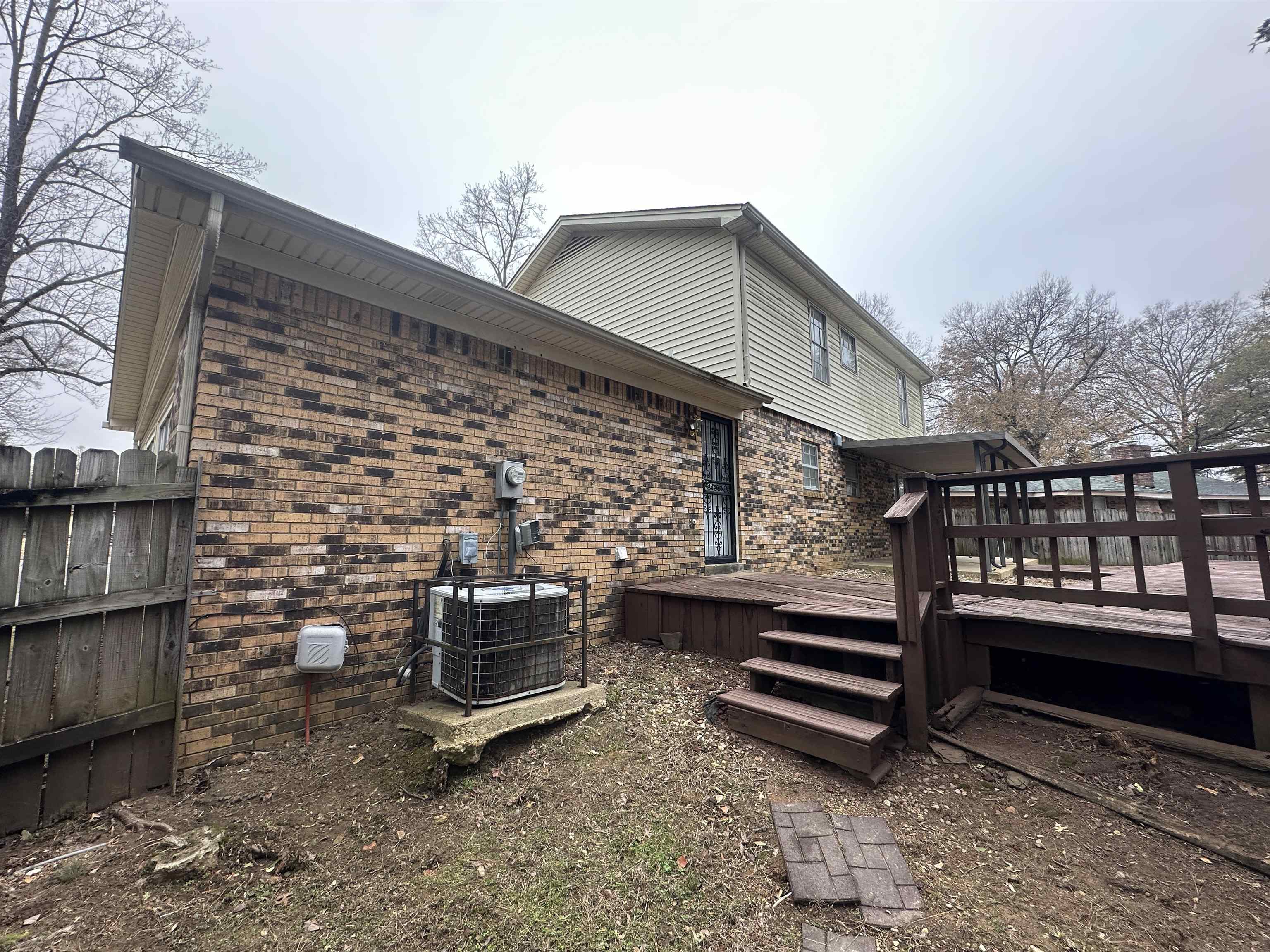 2111 Rock Ridge Road Memphis, TN 38134 - Photo 5 of 20 a backyard of a house with barbeque oven and outdoor seating