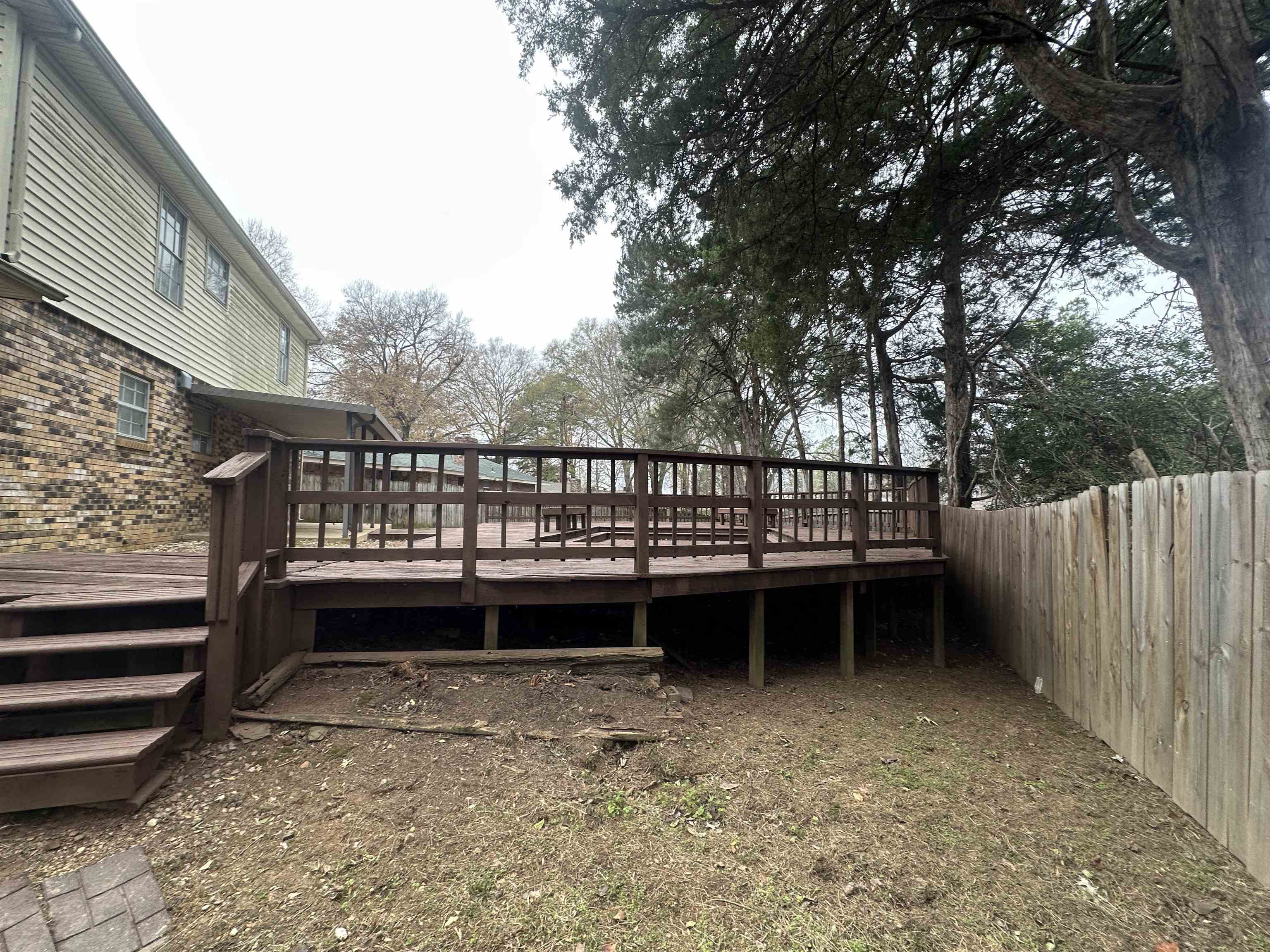 2111 Rock Ridge Road Memphis, TN 38134 - Photo 6 of 20 a view of a yard with wooden floor and fence