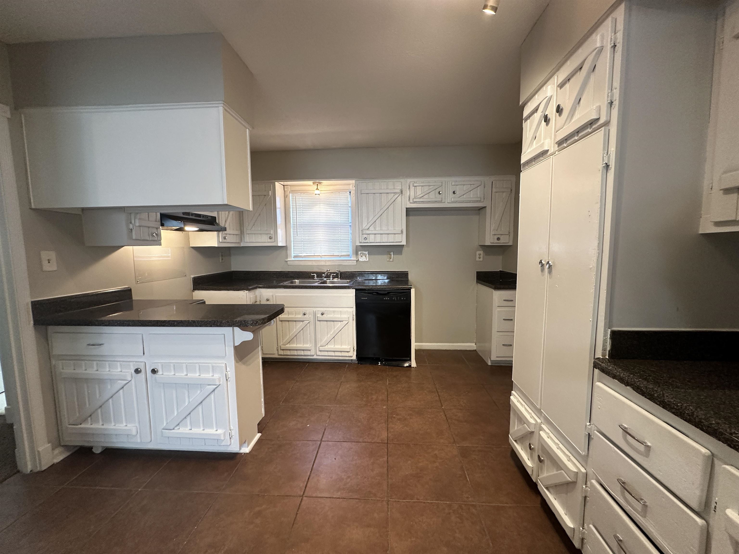 2111 Rock Ridge Road Memphis, TN 38134 - Photo 7 of 20 a kitchen with stainless steel appliances granite countertop a stove a sink and a refrigerator
