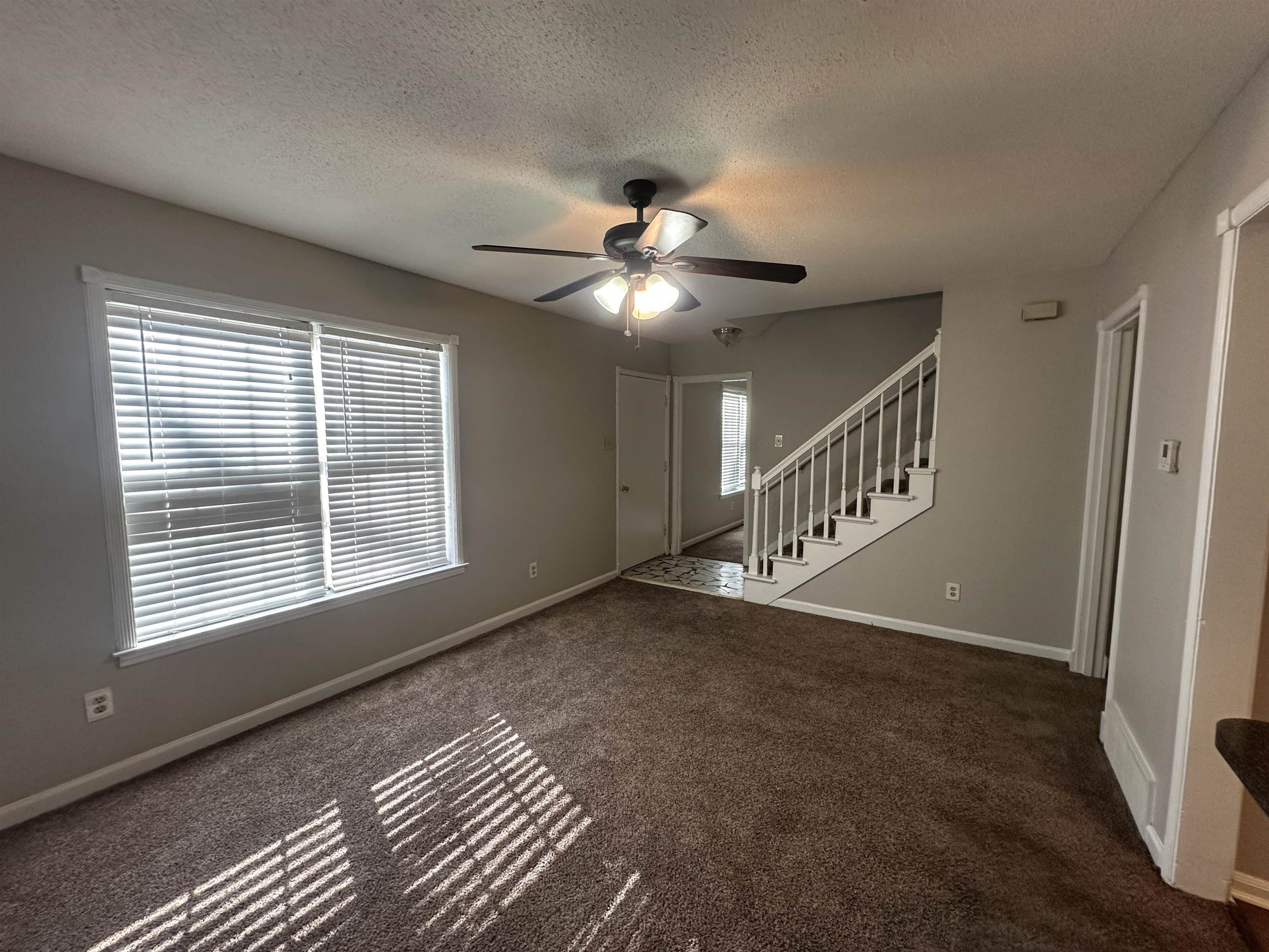 2111 Rock Ridge Road Memphis, TN 38134 - Photo 9 of 20 a view of an empty room with a window