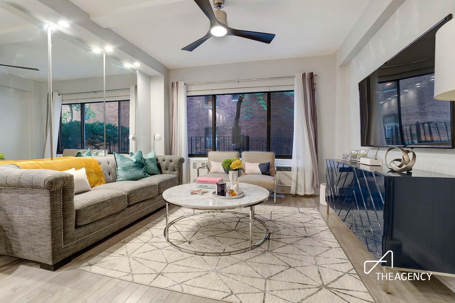 a living room with furniture and a large window