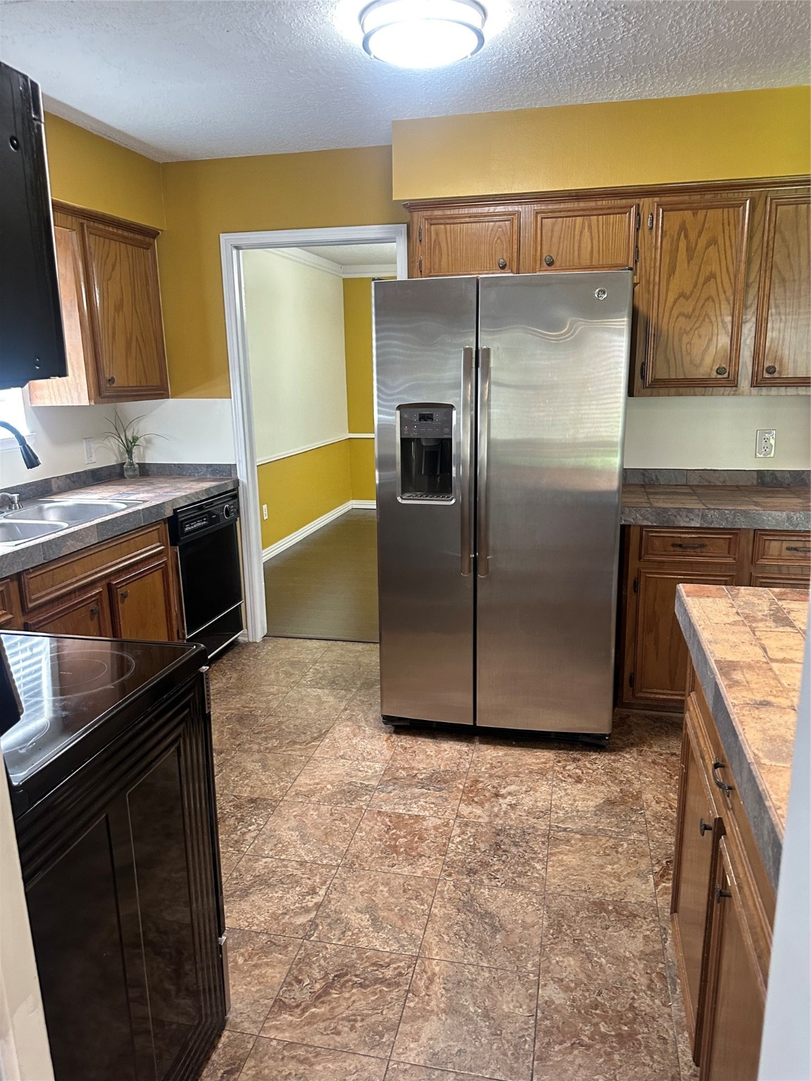 17722 Sorrell Ridge Drive Spring, TX 77388 - Photo 7 of 37 a kitchen with granite countertop a refrigerator stove and sink