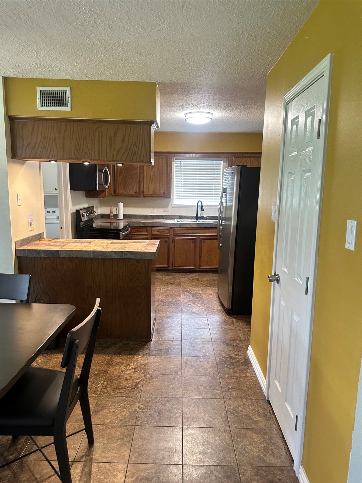 17722 Sorrell Ridge Drive Spring, TX 77388 - Photo 9 of 37 a kitchen with stainless steel appliances granite countertop a sink and cabinets