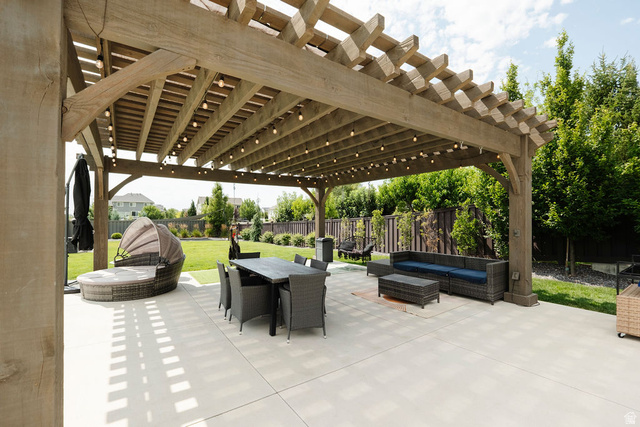 924 Country Lane Farmington, UT 84025 - Photo 73 of 91 Expansive patio area featuring a substantial wooden pergola with string lighting