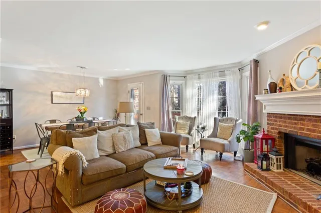 a view of a dining room with furniture kitchen and chandelier
