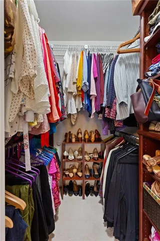 a bathroom with a granite countertop sink mirror toilet and bathtub