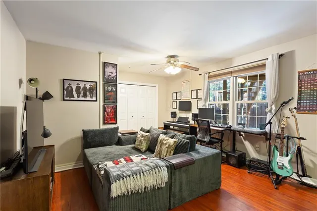a bathroom with a sink a toilet a mirror and shower curtain
