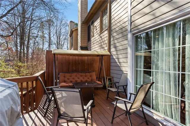 a view of a chairs and table in the patio