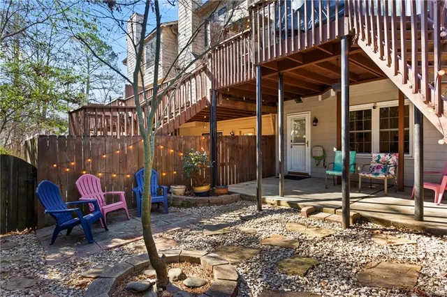 an aerial view of a house with a yard and sitting space