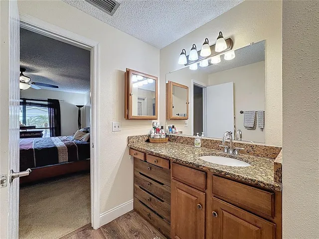 a bathroom with a shower and a sink
