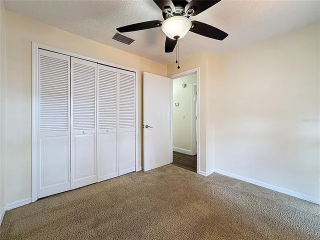 a view of a garage with rack and bicycle