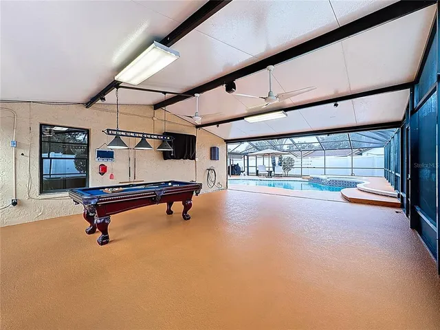 a view of a swimming pool with a patio