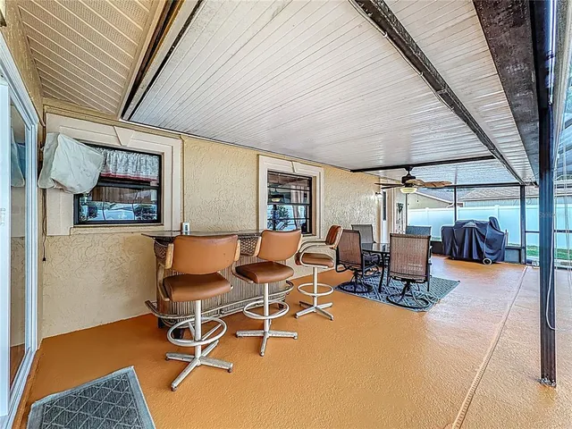 a view of a swimming pool with a patio