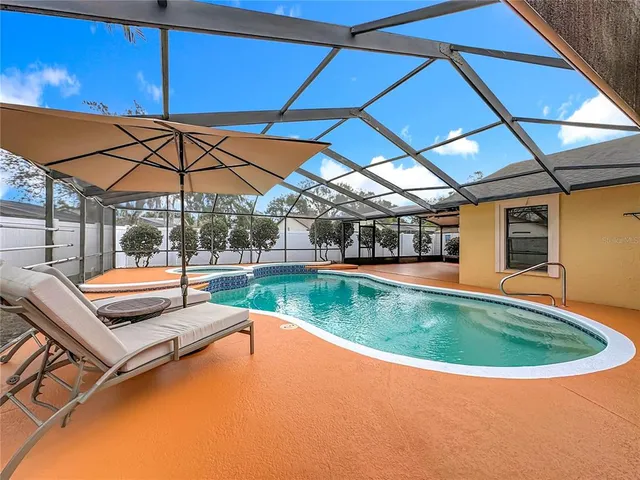 a view of a yard with a large tree