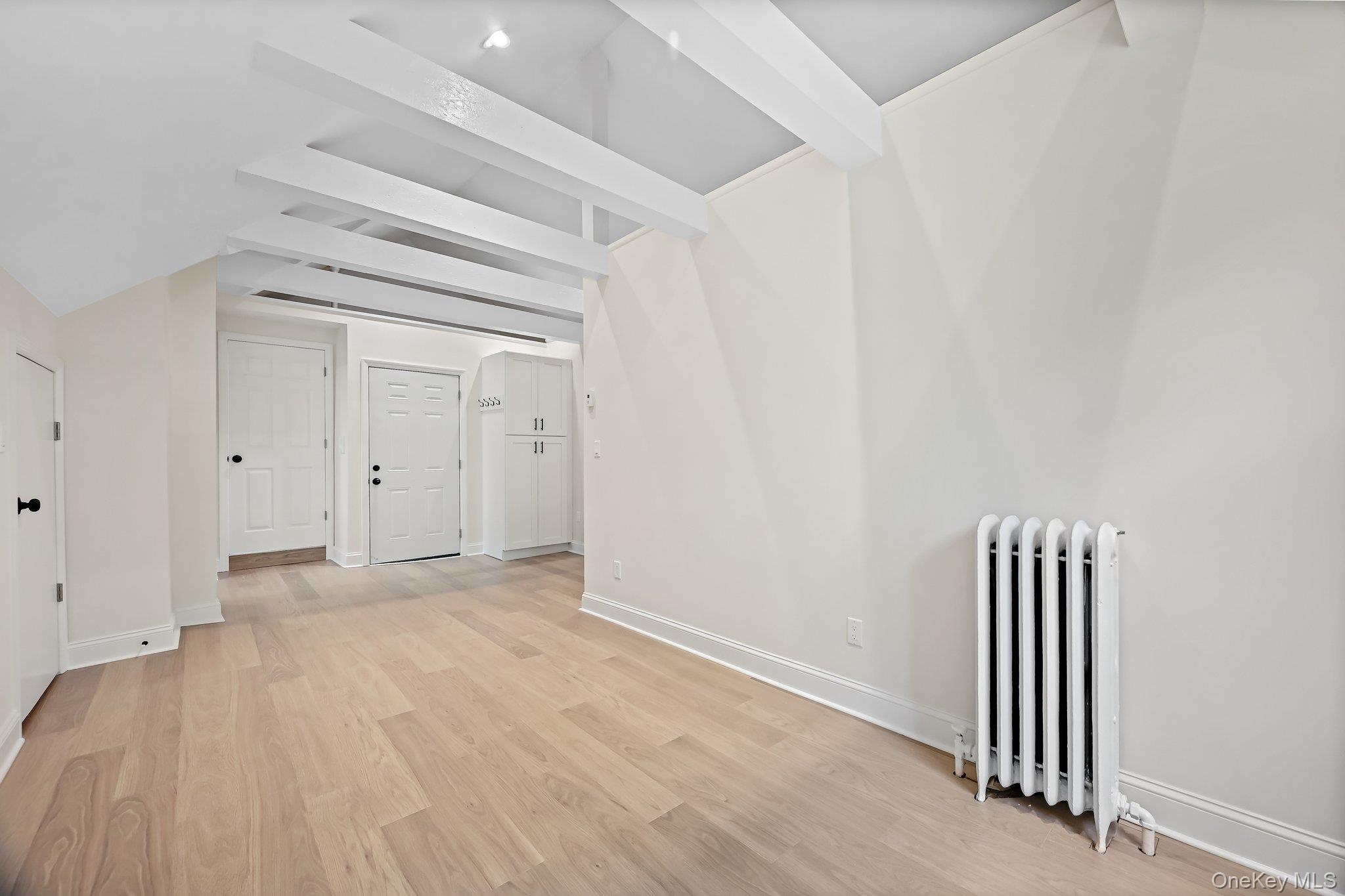 12 Thomas Place, Unit 3 New Rochelle, NY 10801 - Photo 5 of 7 an empty room with windows