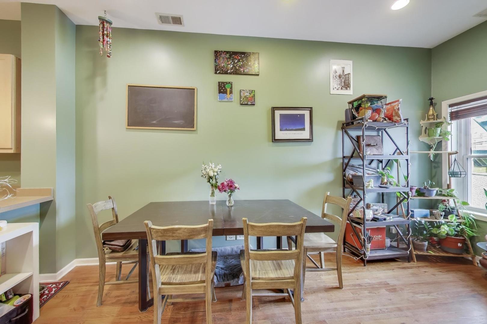 2451 South Western Avenue, Unit 2S Chicago, IL 60608 - Photo 6 of 16 a view of a dining room with furniture and wooden floor