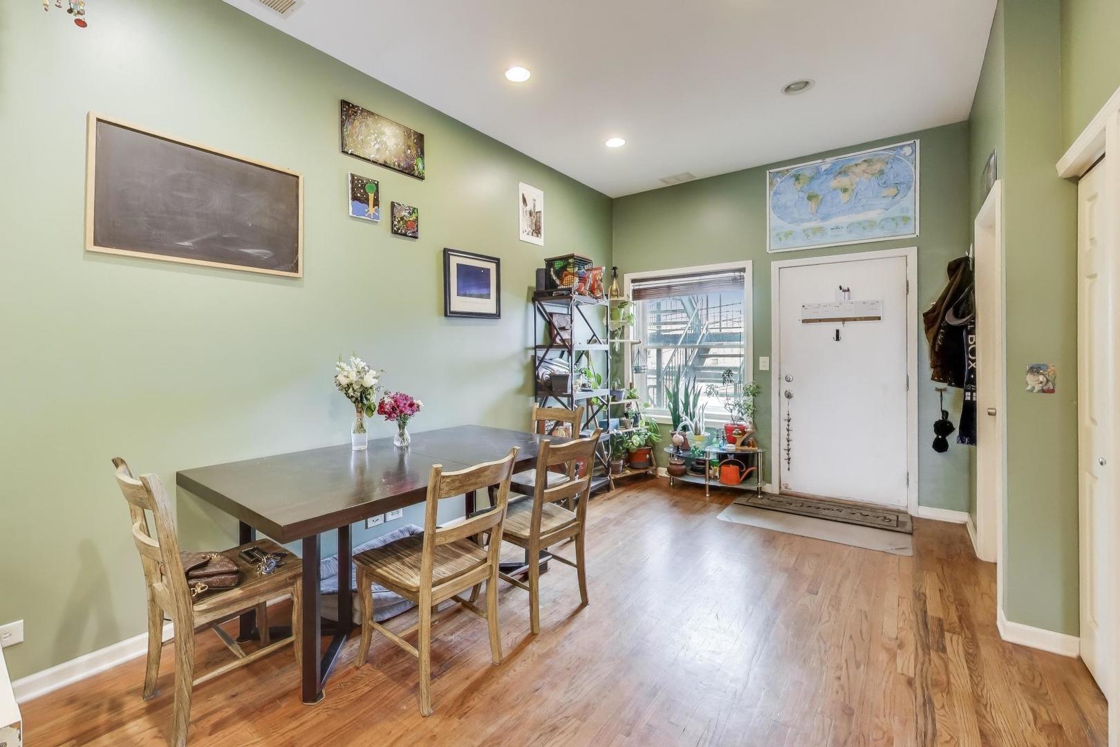 2451 South Western Avenue, Unit 2S Chicago, IL 60608 - Photo 7 of 16 a view of a livingroom with furniture wooden floor and front door