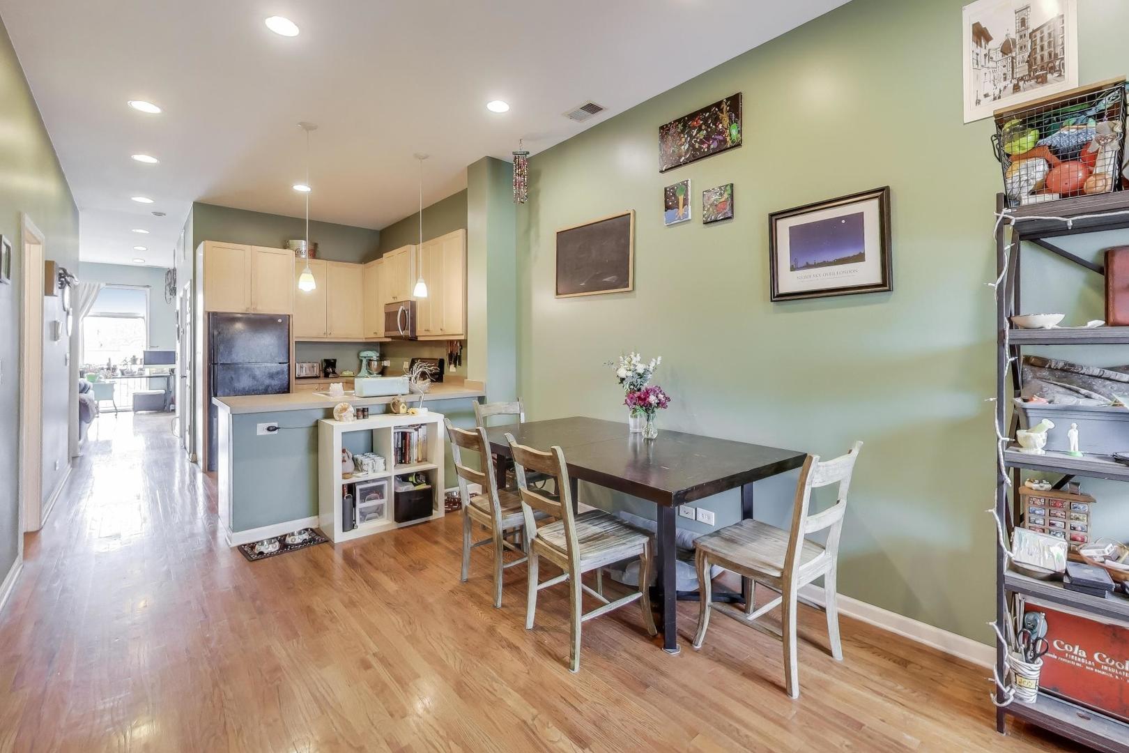 2451 South Western Avenue, Unit 2S Chicago, IL 60608 - Photo 8 of 16 a view of a dining room with furniture and wooden floor