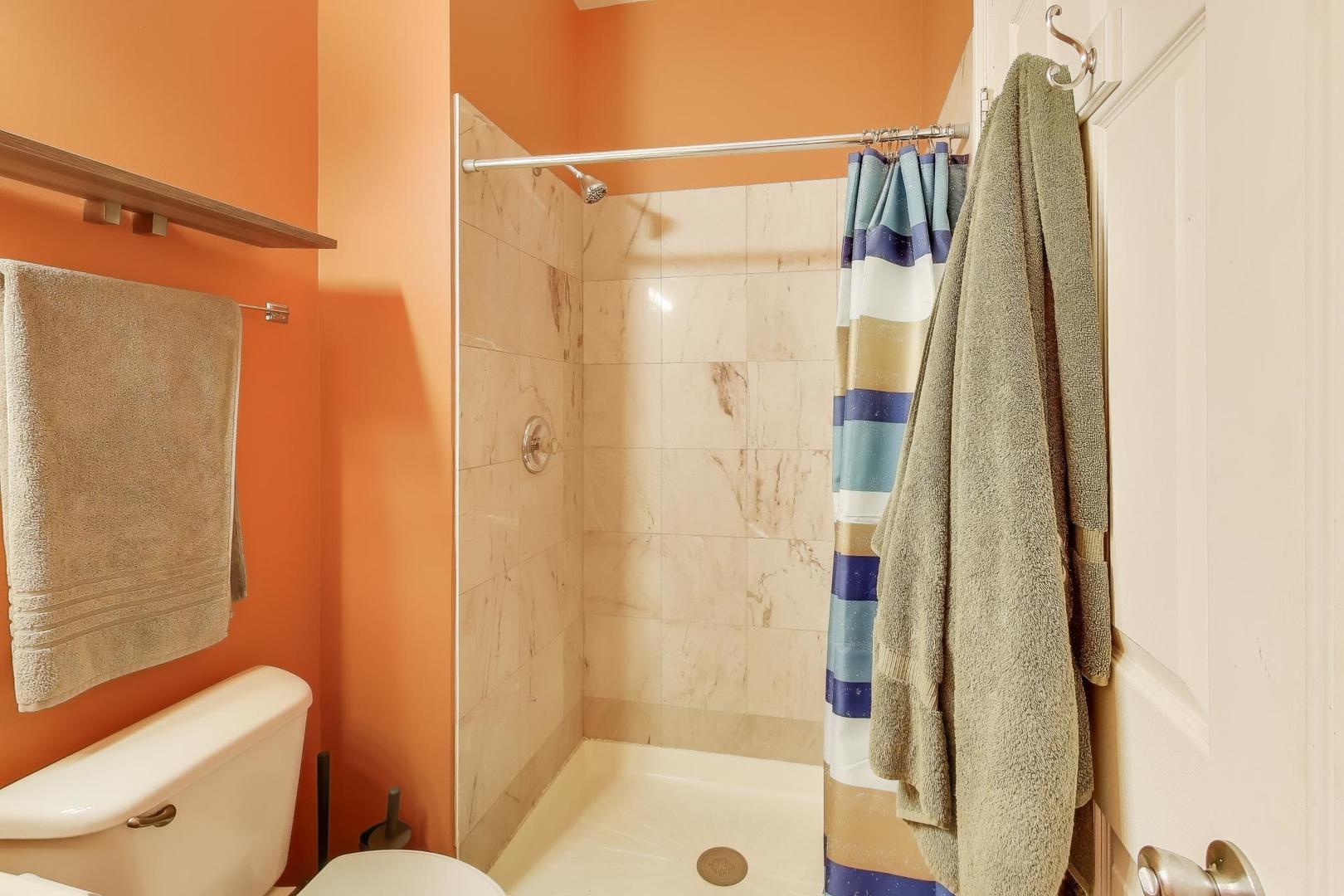 2451 South Western Avenue, Unit 2S Chicago, IL 60608 - Photo 10 of 16 a bathroom with a shower and a toilet