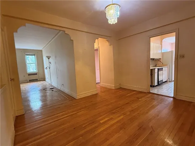 a view of a livingroom with wooden floor