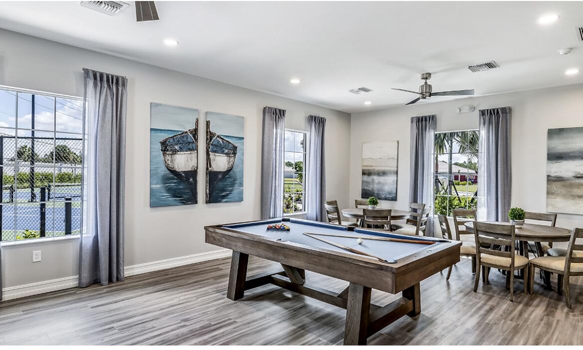 911 Enbrook Loop Naples, FL 34114 - Photo 17 of 20 a view of a livingroom with furniture and window
