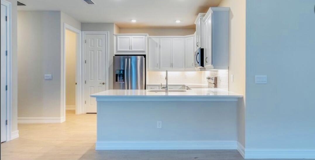 911 Enbrook Loop Naples, FL 34114 - Photo 4 of 20 a bathroom with a sink and a mirror