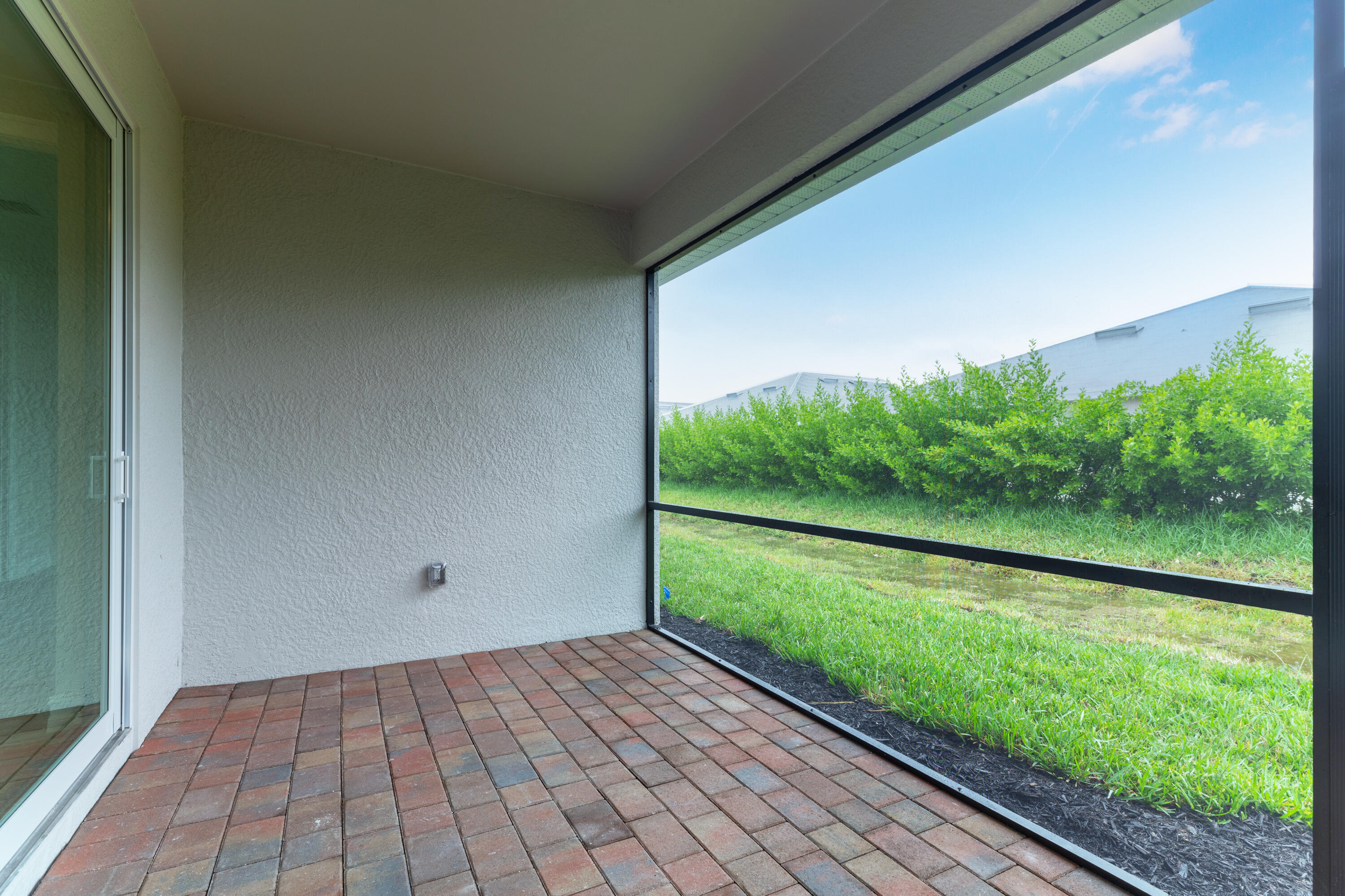 911 Enbrook Loop Naples, FL 34114 - Photo 10 of 20 a view of a back yard from a window