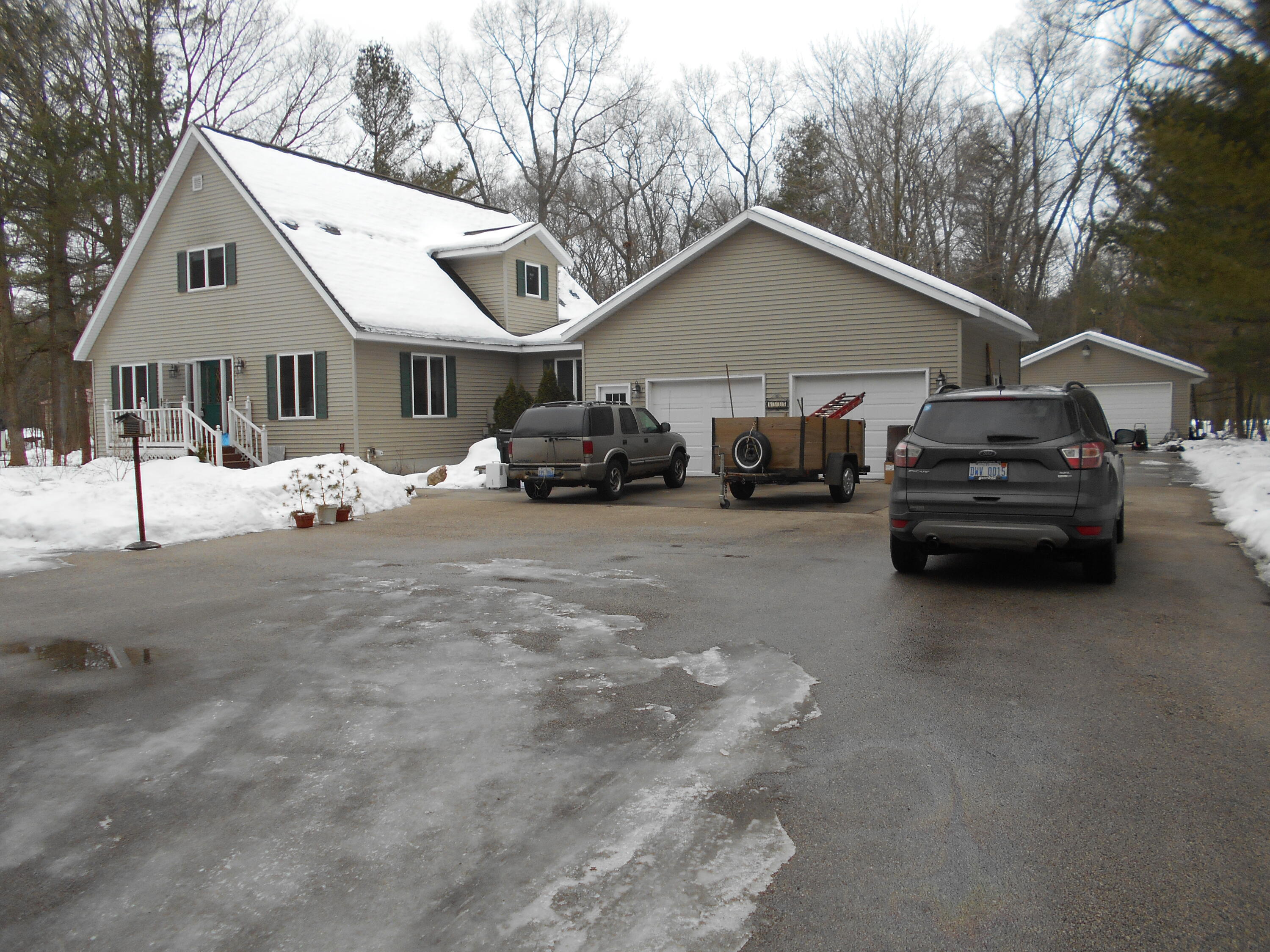 8335 Lamos Road Montague, MI 49437 - Photo 1 of 36 Front photo