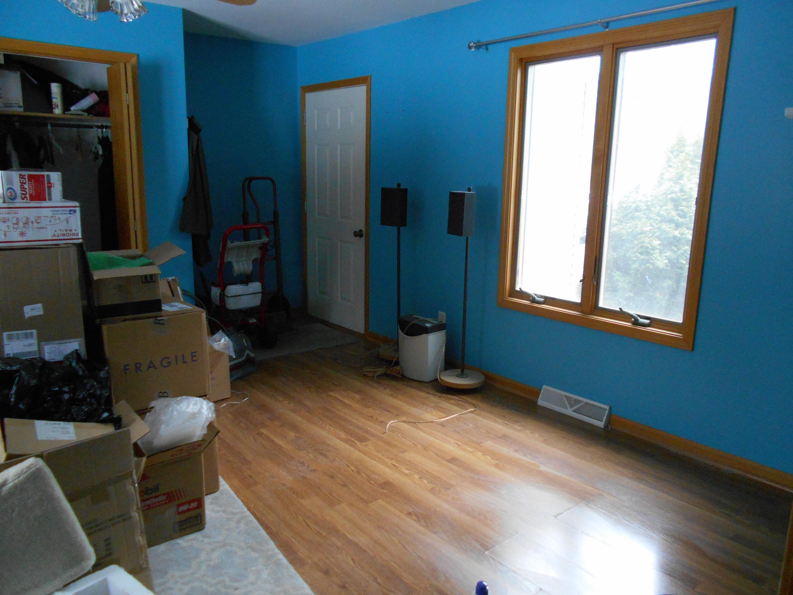 8335 Lamos Road Montague, MI 49437 - Photo 13 of 36 Family Room door to garagem