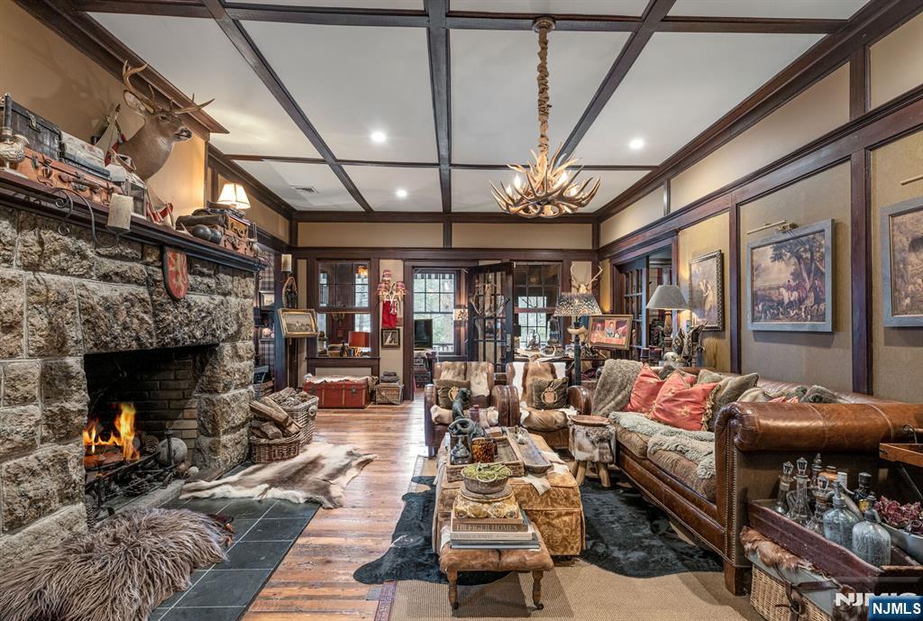 26 Short Road Bloomingdale, NJ 07420 - Photo 16 of 46 a living room with furniture and a fireplace