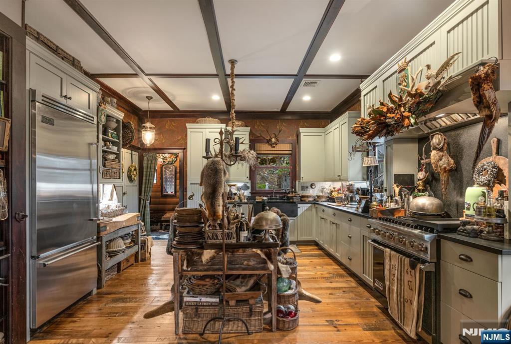 26 Short Road Bloomingdale, NJ 07420 - Photo 18 of 46 a kitchen with lots of counter top space and stainless steel appliances