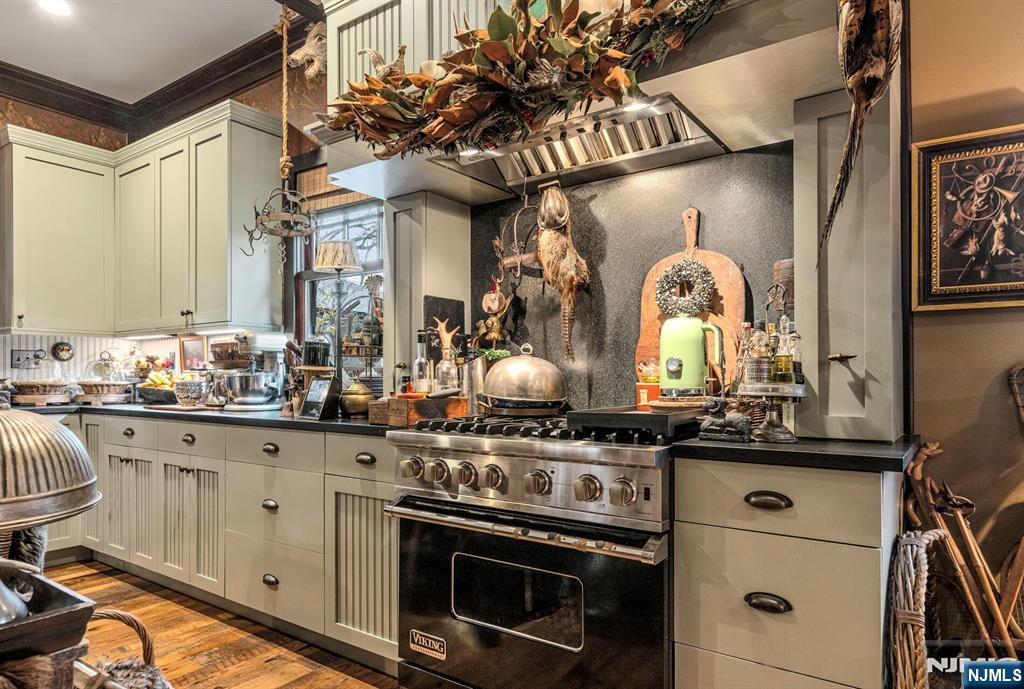 26 Short Road Bloomingdale, NJ 07420 - Photo 19 of 46 a kitchen with stainless steel appliances granite countertop a stove and cabinets
