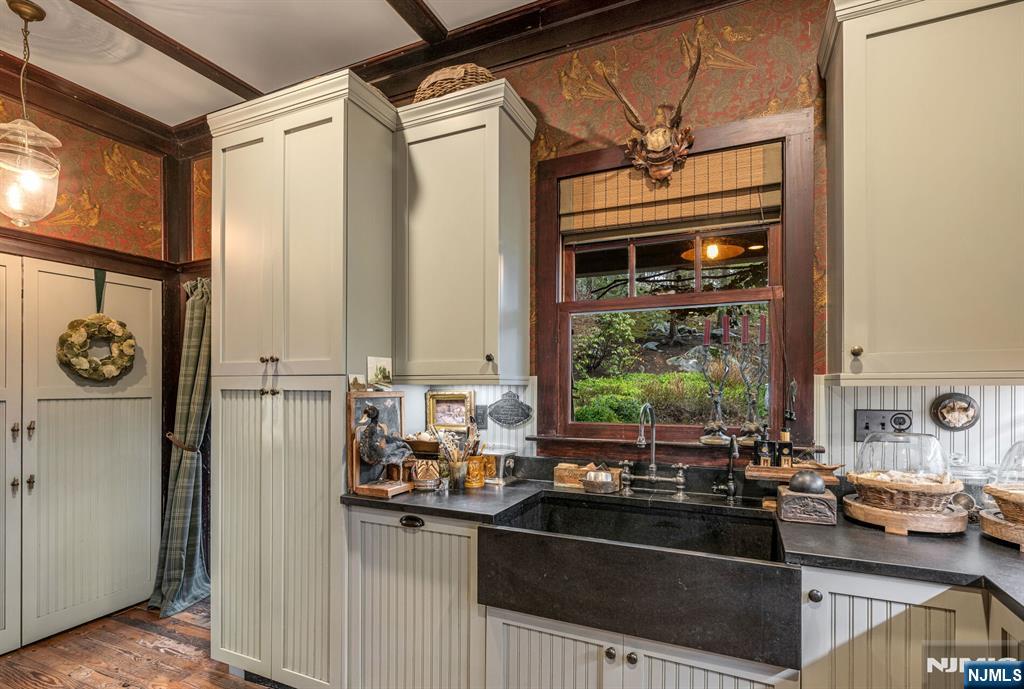 26 Short Road Bloomingdale, NJ 07420 - Photo 20 of 46 a kitchen with stainless steel appliances a sink and a window