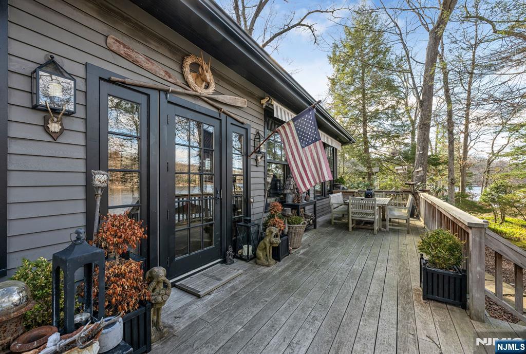 26 Short Road Bloomingdale, NJ 07420 - Photo 33 of 46 a backyard of a house with wooden floor and outdoor seating