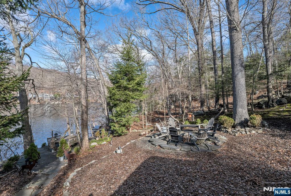 26 Short Road Bloomingdale, NJ 07420 - Photo 34 of 46 a view of swimming pool with lawn chairs and plants