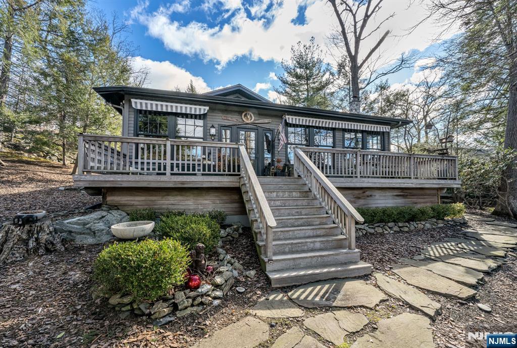 26 Short Road Bloomingdale, NJ 07420 - Photo 43 of 46 a view of a house with a deck and a garden