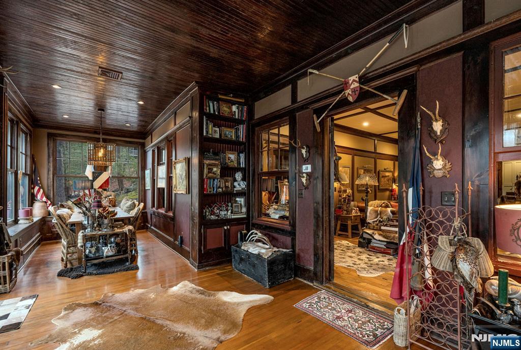 26 Short Road Bloomingdale, NJ 07420 - Photo 10 of 46 a view of living room with glass top table and chairs