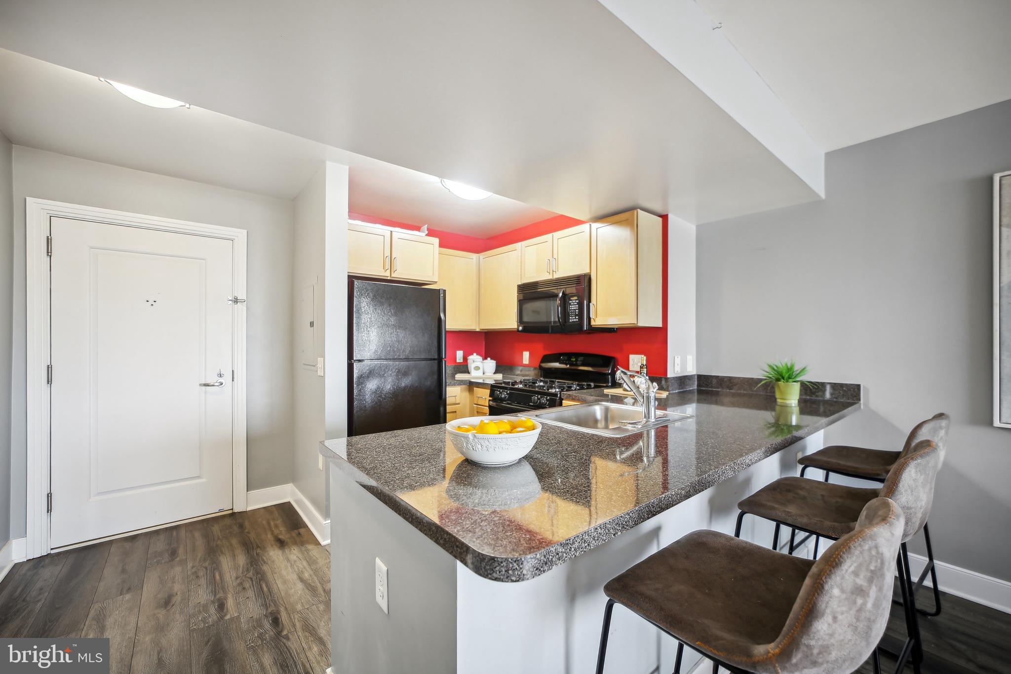800 4th Street Southwest, Unit S717 Washington, DC 20024 - Photo 15 of 36 Kitchen With Solid Surface Counters