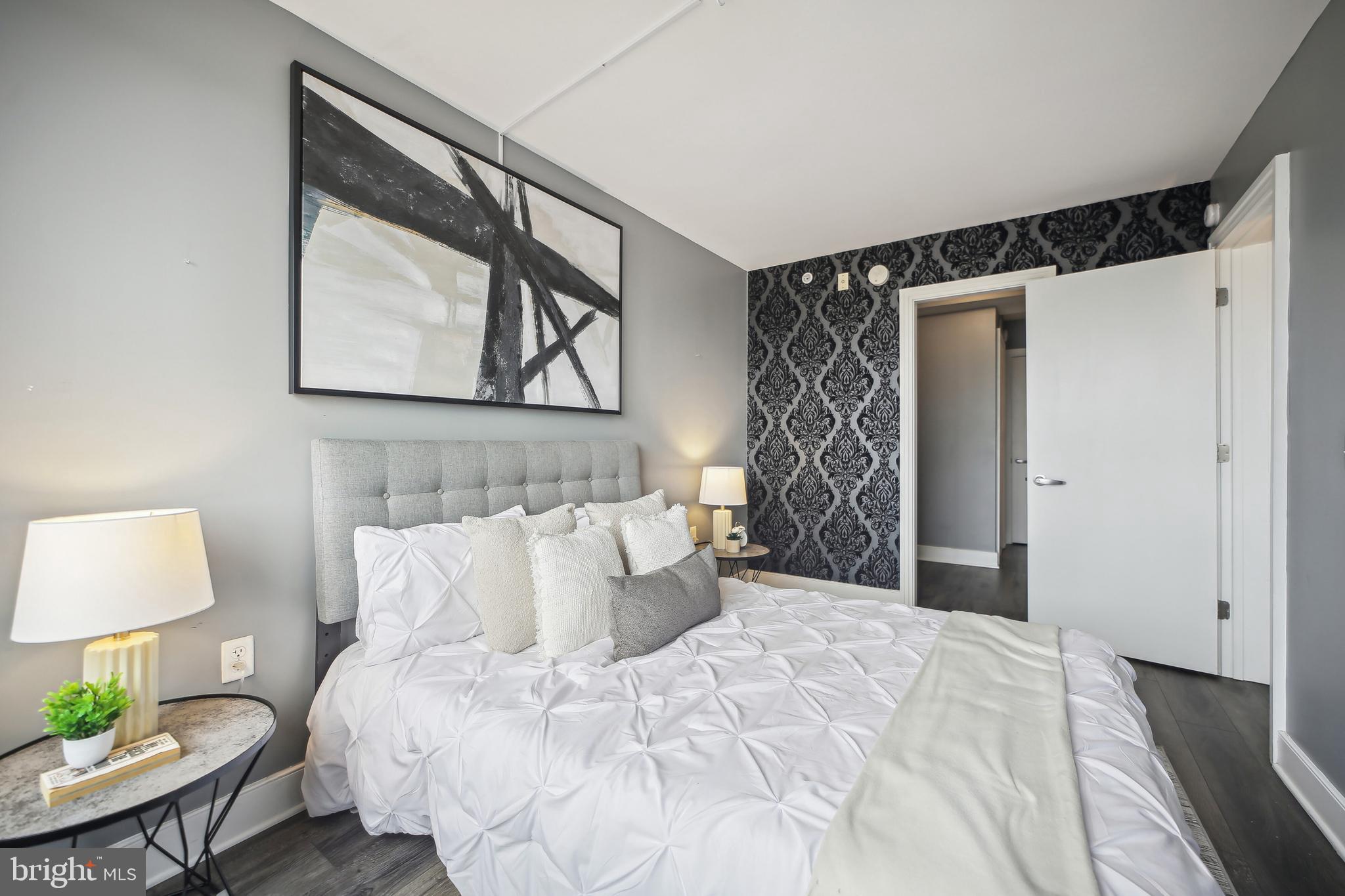 800 4th Street Southwest, Unit S717 Washington, DC 20024 - Photo 24 of 36 Bedroom With Accent Wall