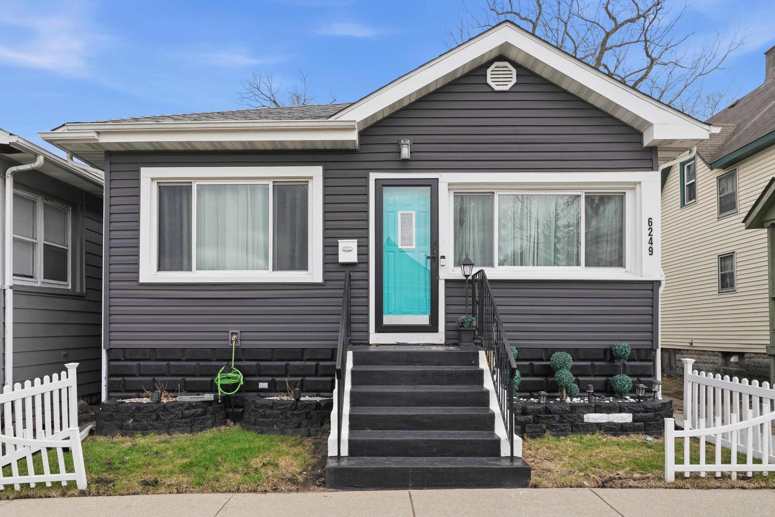 6249 Monroe Avenue Hammond, IN 46324 - Photo 1 of 22 a front view of a house with a yard
