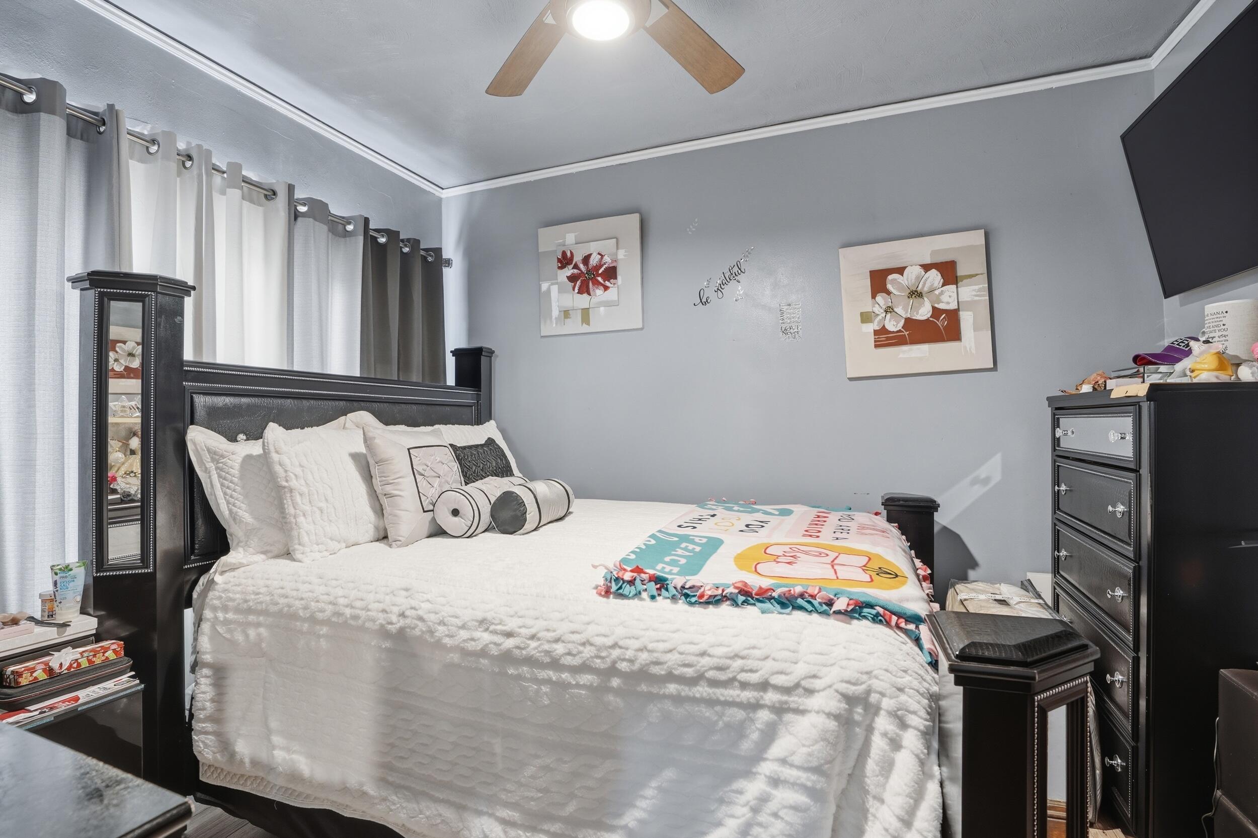 6249 Monroe Avenue Hammond, IN 46324 - Photo 11 of 22 a bedroom with a bed and a flat screen tv