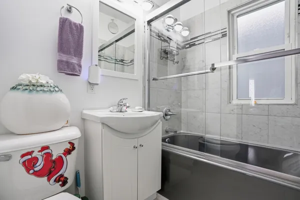 a bathroom with a sink and mirror