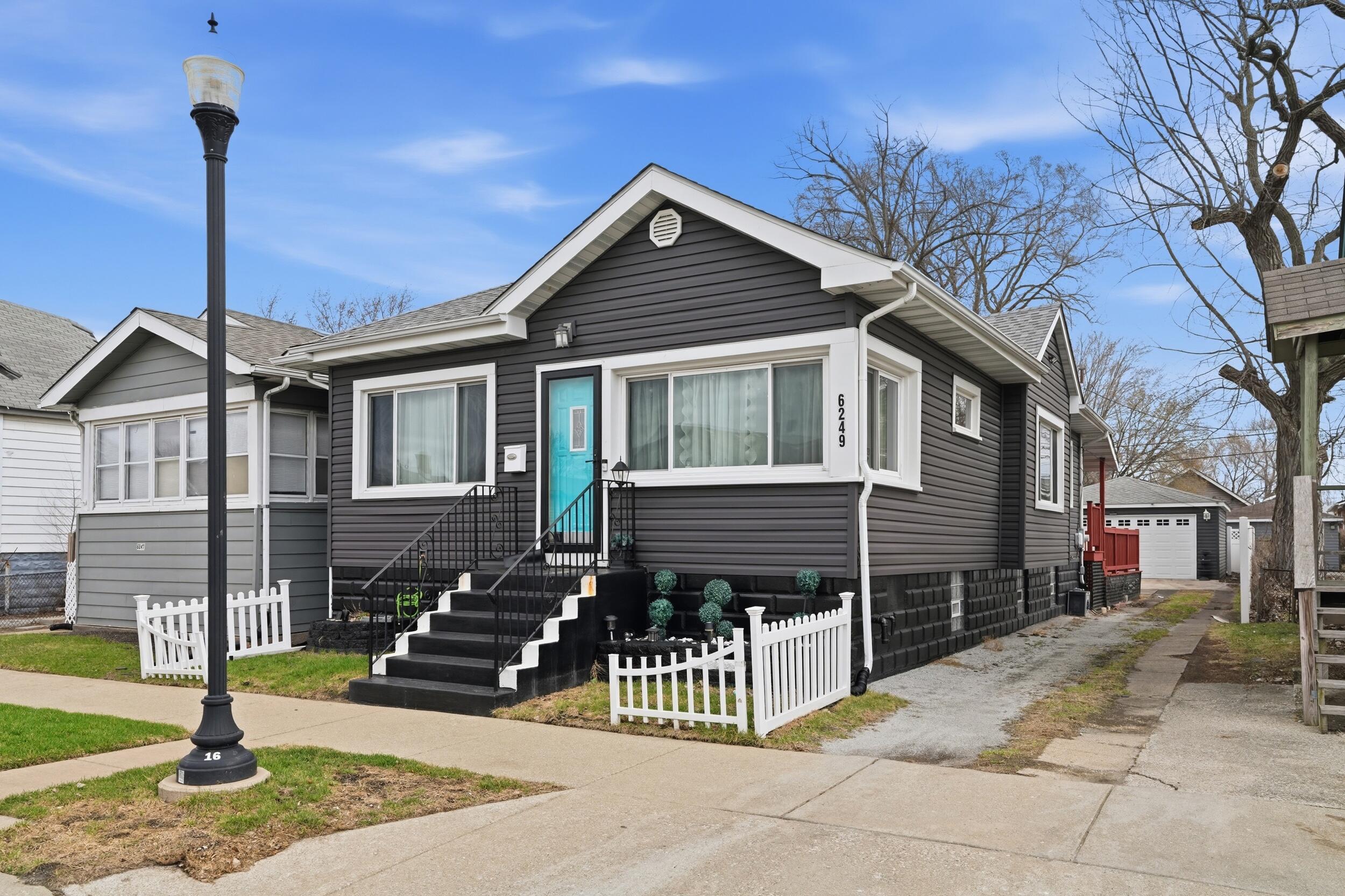 6249 Monroe Avenue Hammond, IN 46324 - Photo 2 of 22 a front view of a house with a porch