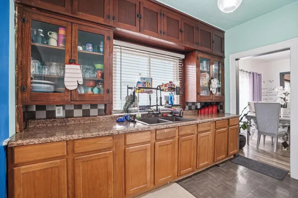 a kitchen with stainless steel appliances granite countertop a sink and cabinets