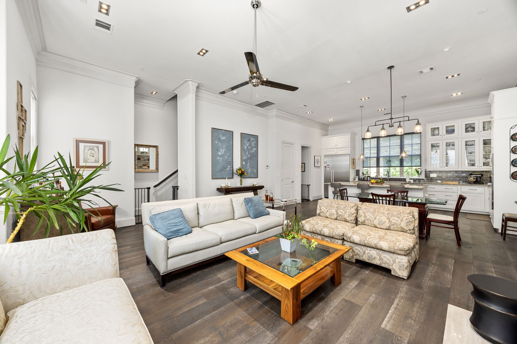 11 Robita Street Houston, TX 77019 - Photo 32 of 32 a living room with furniture a ceiling fan and a chandelier