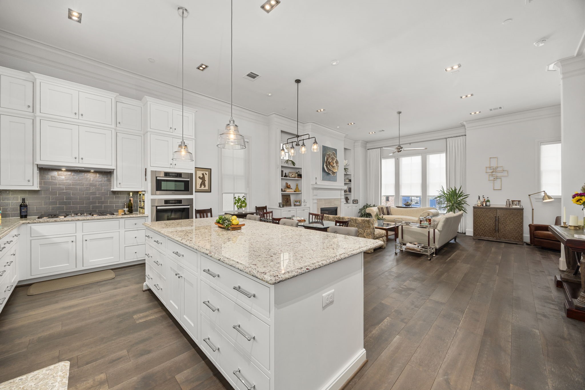 11 Robita Street Houston, TX 77019 - Photo 12 of 32 a kitchen with sink stove and cabinets