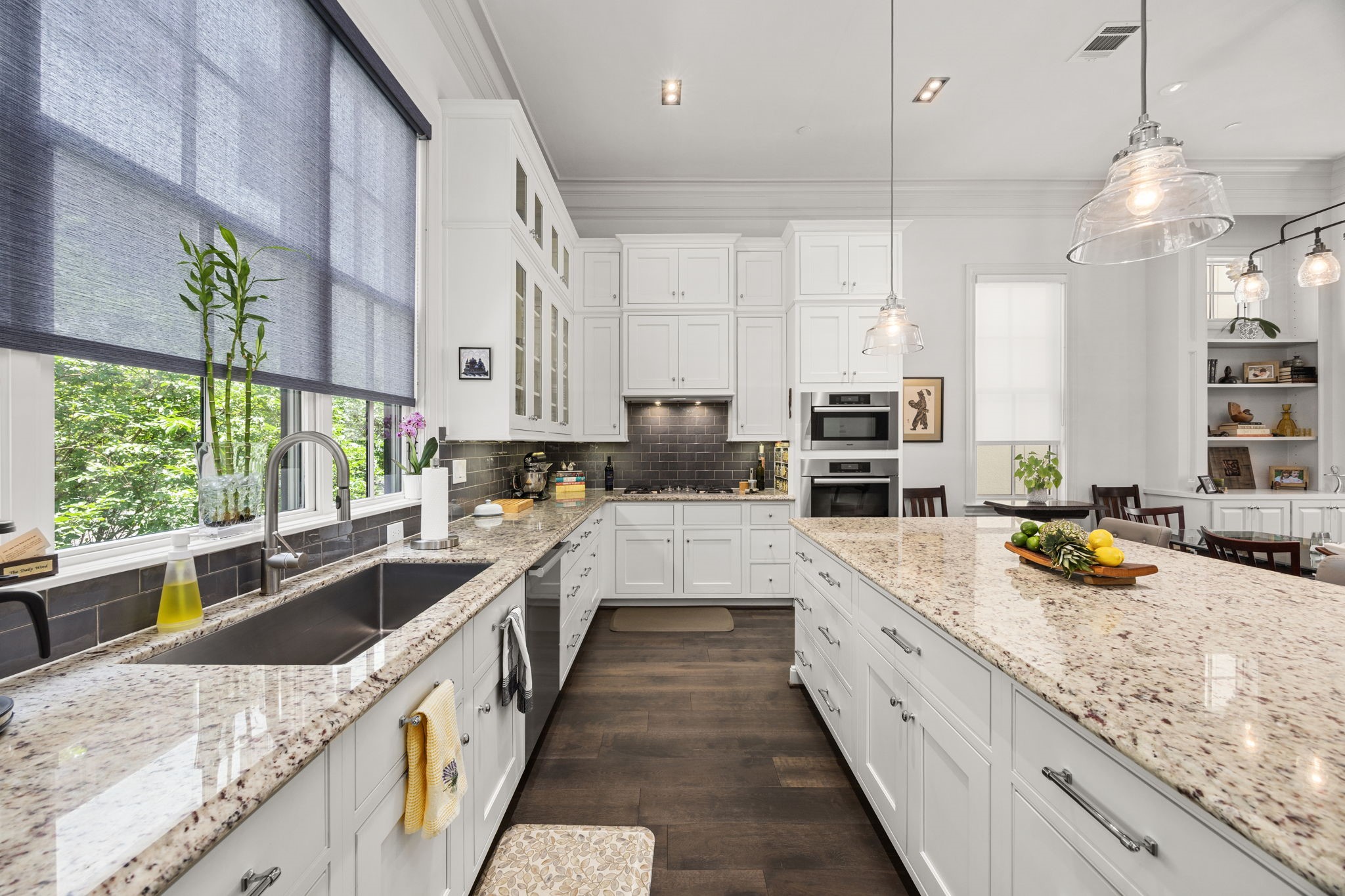 11 Robita Street Houston, TX 77019 - Photo 13 of 32 a large kitchen with a large window and stainless steel appliances